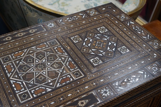 A 19th century Damascus mother of pearl, bone, and marquetry inlaid folding games table, with card, backgammon and chess surfaces, width 94cm, depth 47cm, height 85cm